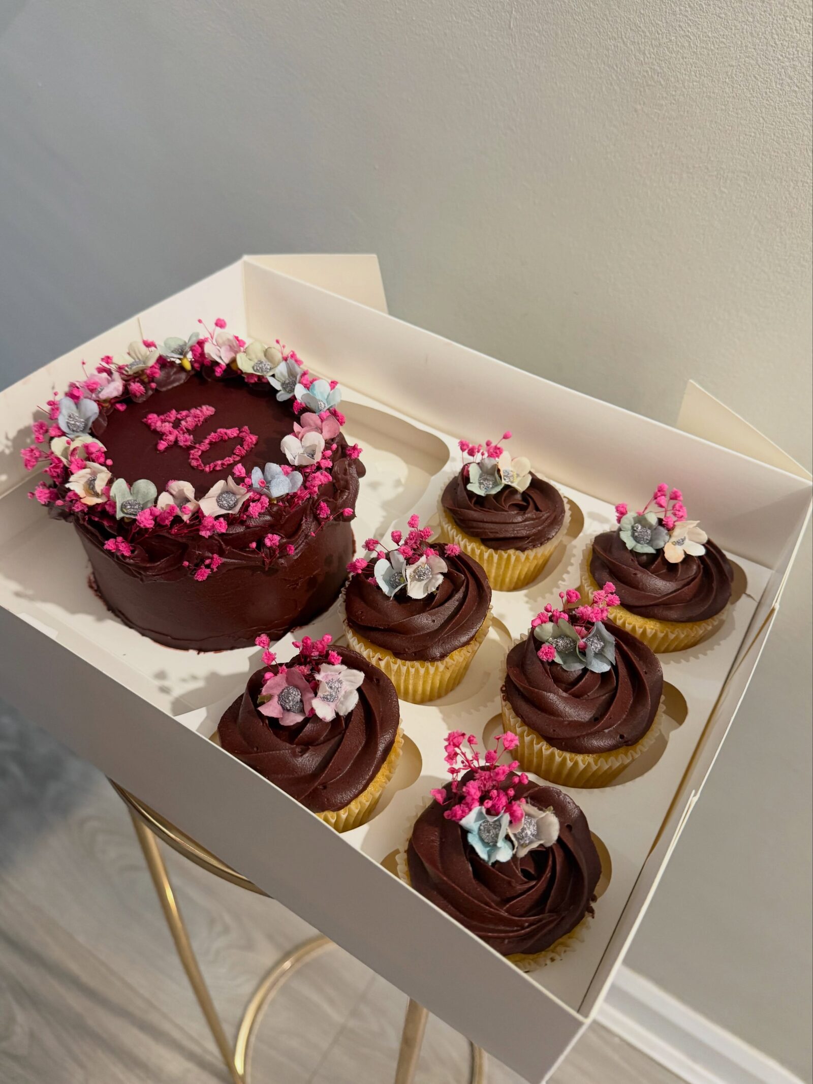Chocolate bento cake with matching floral cupcakes in a gift box